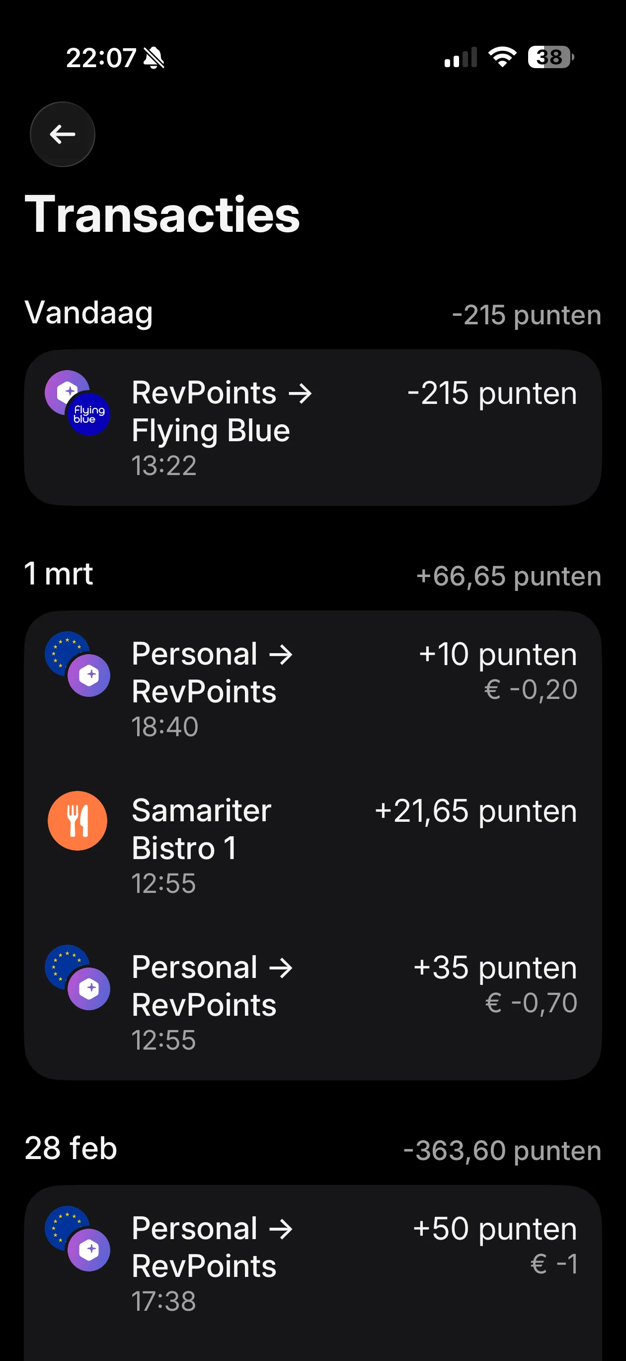 Revolut RevPoints transaction history showing Flying Blue transfer of 215 points, restaurant earning of 21.65 points, and manual top-ups