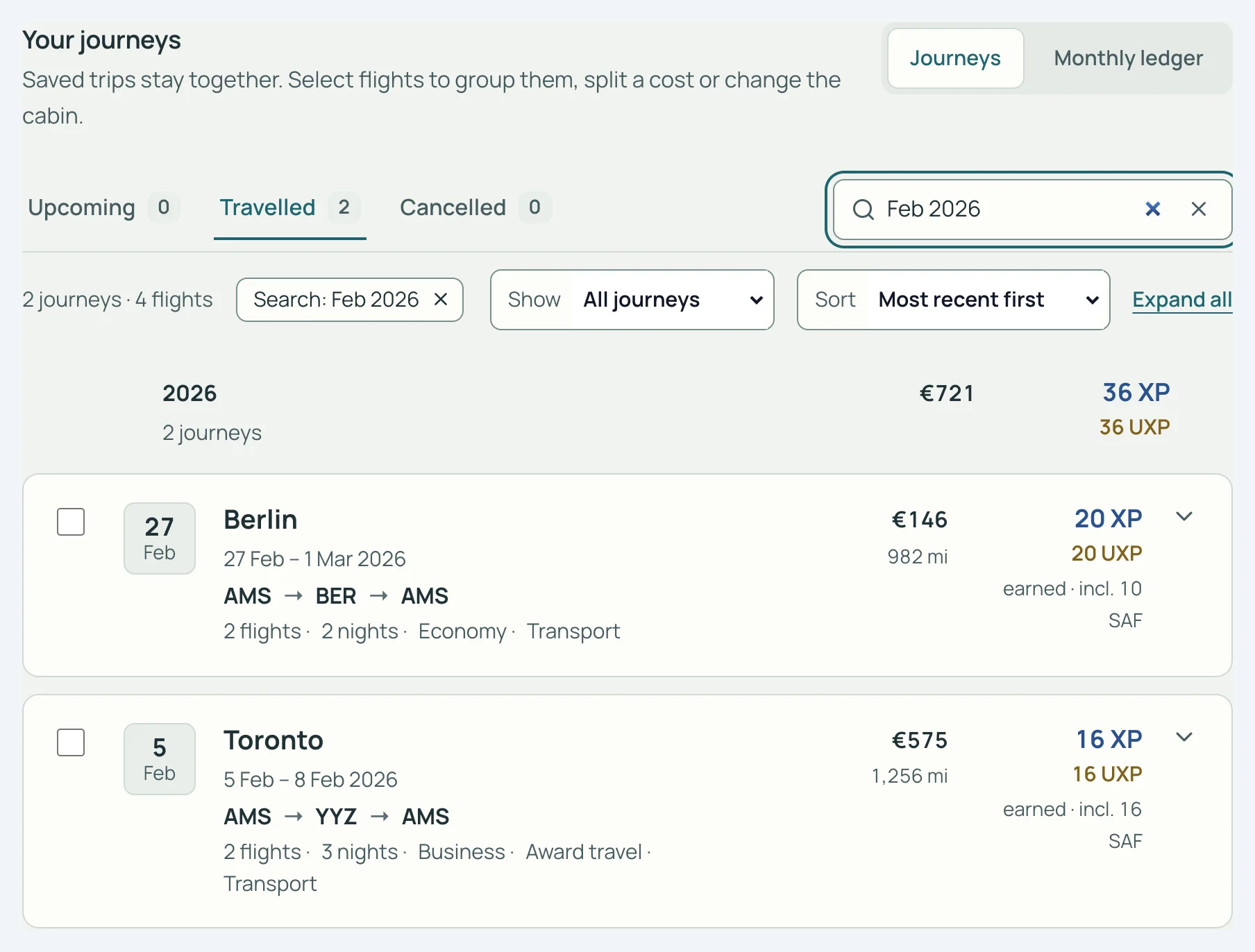 Flights-scherm in SkyStatus, februari 2026: Berlijn in Economy, 20 XP waarvan 10 SAF, en Toronto in Business als Award travel, 16 XP waarvan 16 SAF.